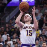 Nov 23, 2025; Salt Lake City, Utah, USA; Los Angeles Lakers guard Austin Reaves (15) takes a shot at the buzzer against the Utah Jazz to end the first half at Delta Center. Mandatory Credit: Rob Gray-Imagn Images