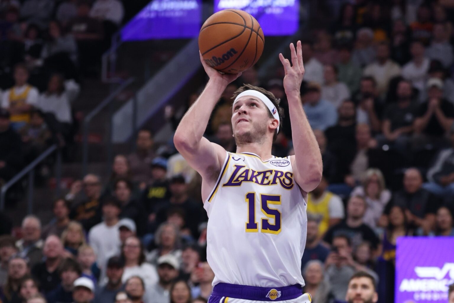 Nov 23, 2025; Salt Lake City, Utah, USA; Los Angeles Lakers guard Austin Reaves (15) takes a shot at the buzzer against the Utah Jazz to end the first half at Delta Center. Mandatory Credit: Rob Gray-Imagn Images