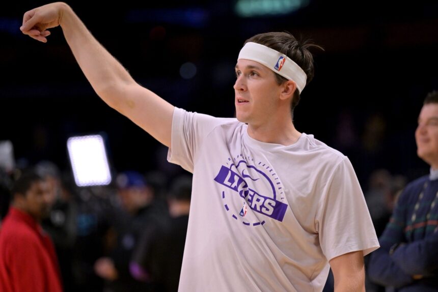 Dec 10, 2025; Los Angeles, California, USA; Los Angeles Lakers guard Austin Reaves (15) warms up prior to the game against the San Antonio Spurs at Crypto.com Arena. Mandatory Credit: Jayne Kamin-Oncea-Imagn Images