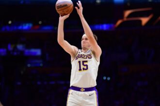 Nov 30, 2025; Los Angeles, California, USA; Los Angeles Lakers guard Austin Reaves (15) shoots against the New Orleans Pelicans during the first half at Crypto.com Arena. Mandatory Credit: Gary A. Vasquez-Imagn Images