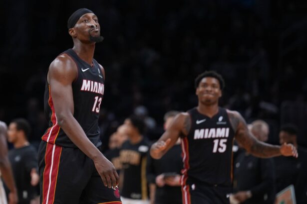 Miami Heat center Bam Adebayo (13) walks to the sideline during a break against the Boston Celtics in the second half at TD Garden.