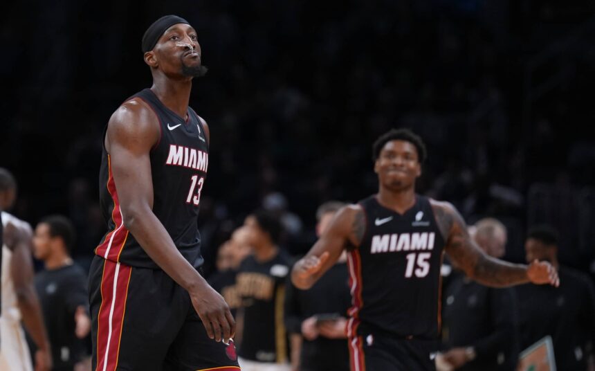 Miami Heat center Bam Adebayo (13) walks to the sideline during a break against the Boston Celtics in the second half at TD Garden.