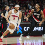Dec 22, 2025; Portland, Oregon, USA; Detroit Pistons guard Cade Cunningham (2) dribbles the ball during the first half against Portland Trail Blazers forward Kris Murray (24) at Moda Center. Mandatory Credit: Troy Wayrynen-Imagn Images