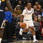 Oct 12, 2025; Inglewood, California, USA; Los Angeles Clippers guard Chris Paul (3) moves the ball against Denver Nuggets guard/forward Tim Hardaway Jr. (10) during the first quarter at Intuit Dome. Mandatory Credit: Jonathan Hui-Imagn Images