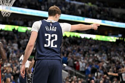 Dec 18, 2025; Dallas, Texas, USA; Dallas Mavericks forward Cooper Flagg (32) motions for Dallas possession during overtime against the Detroit Pistons at the American Airlines Center. Mandatory Credit: Jerome Miron-Imagn Images