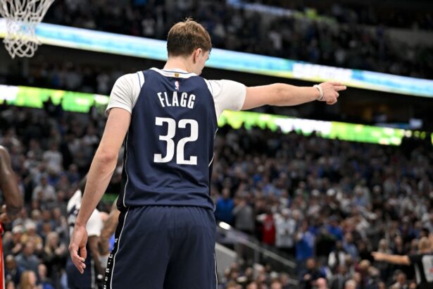 Dec 18, 2025; Dallas, Texas, USA; Dallas Mavericks forward Cooper Flagg (32) motions for Dallas possession during overtime against the Detroit Pistons at the American Airlines Center. Mandatory Credit: Jerome Miron-Imagn Images