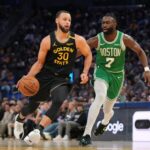 Jan 20, 2025; San Francisco, California, USA; Golden State Warriors guard Stephen Curry (30) dribbles past Boston Celtics forward Jaylen Brown (7) in the third quarter at the Chase Center. Mandatory Credit: Cary Edmondson-Imagn Images