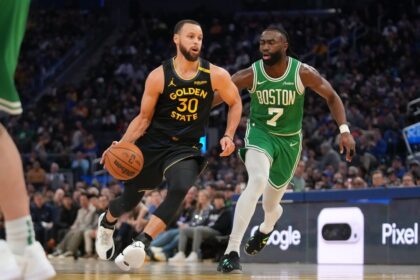 Jan 20, 2025; San Francisco, California, USA; Golden State Warriors guard Stephen Curry (30) dribbles past Boston Celtics forward Jaylen Brown (7) in the third quarter at the Chase Center. Mandatory Credit: Cary Edmondson-Imagn Images