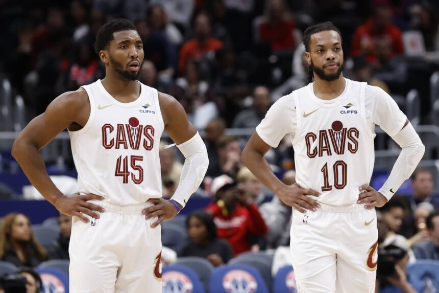 Dec 12, 2025; Washington, District of Columbia, USA; Cleveland Cavaliers guard Donovan Mitchell (45) stands next to Cavaliers guard Darius Garland (10) on court during a stoppage in play against the Washington Wizards in the second half at Capital One Arena. Mandatory Credit: Geoff Burke-Imagn Images