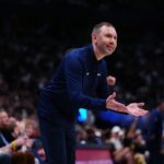 Apr 11, 2025; Denver, Colorado, USA; Denver Nuggets interim head coach David Adelman reacts in the fourth quarter against the Memphis Grizzlies at Ball Arena. Mandatory Credit: Ron Chenoy-Imagn Images