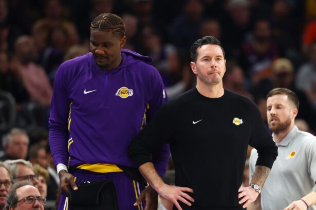 Dec 23, 2025; Phoenix, Arizona, USA; Los Angeles Lakers center Deandre Ayton (left) and head coach JJ Redick against the Phoenix Suns at Mortgage Matchup Center. Mandatory Credit: Mark J. Rebilas-Imagn Images