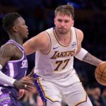 Dec 28, 2025; Los Angeles, California, USA; Sacramento Kings guard Dennis Schroder (17) defemds Los Angeles Lakers guard Luka Doncic (77) in the second half at Crypto.com Arena. Mandatory Credit: Jayne Kamin-Oncea-Imagn Images