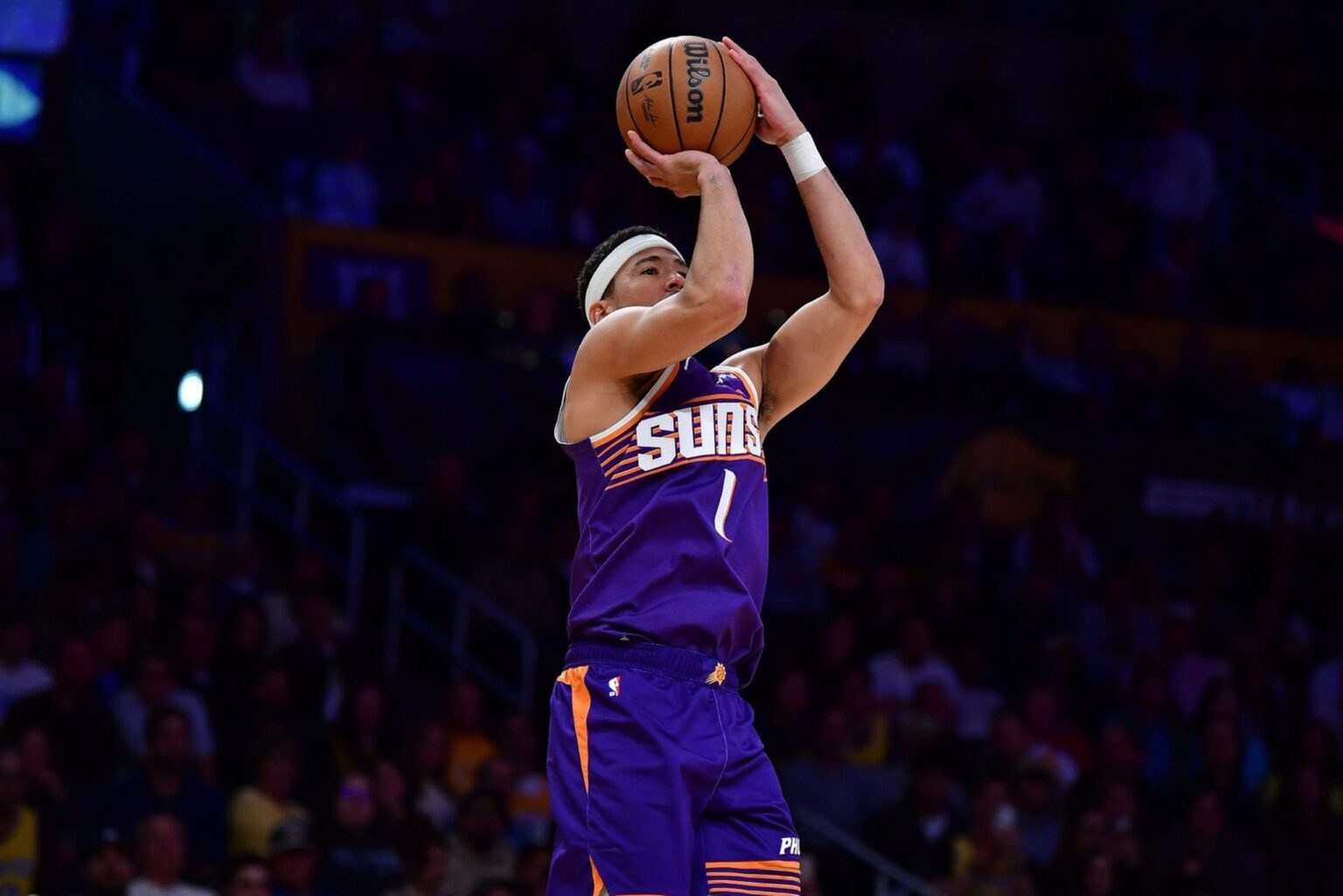 Dec 1, 2025; Los Angeles, California, USA; Phoenix Suns guard Devin Booker (1) shoots against the Los Angeles Lakers during the first half at Crypto.com Arena. Mandatory Credit: Gary A. Vasquez-Imagn Images