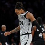 Nov 30, 2025; Minneapolis, Minnesota, USA; San Antonio Spurs guard Devin Vassell (24) reacts during the first half against the Minnesota Timberwolves at Target Center. Mandatory Credit: Matt Krohn-Imagn Images