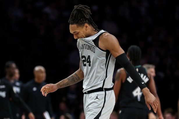 Nov 30, 2025; Minneapolis, Minnesota, USA; San Antonio Spurs guard Devin Vassell (24) reacts during the first half against the Minnesota Timberwolves at Target Center. Mandatory Credit: Matt Krohn-Imagn Images
