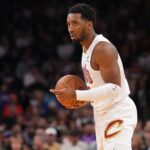 Mar 21, 2025; Phoenix, Arizona, USA; Cleveland Cavaliers guard Donovan Mitchell (45) controls the ball against the Phoenix Suns during the first half at Footprint Center. Mandatory Credit: Joe Camporeale-Imagn Images