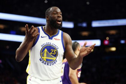 Dec 18, 2025; Phoenix, Arizona, USA; Golden State Warriors forward Draymond Green (23) reacts against the Phoenix Suns at Mortgage Matchup Center. Mandatory Credit: Mark J. Rebilas-Imagn Images