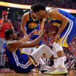Jun 10, 2019; Toronto, Ontario, CAN; Golden State Warriors forward Kevin Durant (35) is helped up by guard Quinn Cook (4) and guard Klay Thompson (11) after an apparent injury during the second quarter in game five of the 2019 NBA Finals against the Toronto Raptors at Scotiabank Arena. Mandatory Credit: Kyle Terada-Imagn Images