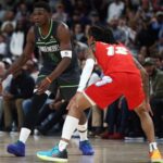 Apr 10, 2025; Memphis, Tennessee, USA; Minnesota Timberwolves guard Anthony Edwards (5) dribbles as Memphis Grizzlies guard Ja Morant (12) defends during the fourth quarter at FedExForum. Mandatory Credit: Petre Thomas-Imagn Images