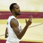 Dec 3, 2025; Cleveland, Ohio, USA; Cleveland Cavaliers center Evan Mobley (4) celebrates a three-point basket in the fourth quarter against the Portland Trail Blazers at Rocket Arena. Mandatory Credit: David Richard-Imagn Images