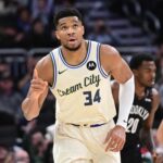 Nov 29, 2025; Milwaukee, Wisconsin, USA; Milwaukee Bucks forward Giannis Antetokounmpo (34) reacts after scoring his 21,000th career point in the third quarter against the Brooklyn Nets at Fiserv Forum. Mandatory Credit: Benny Sieu-Imagn Images