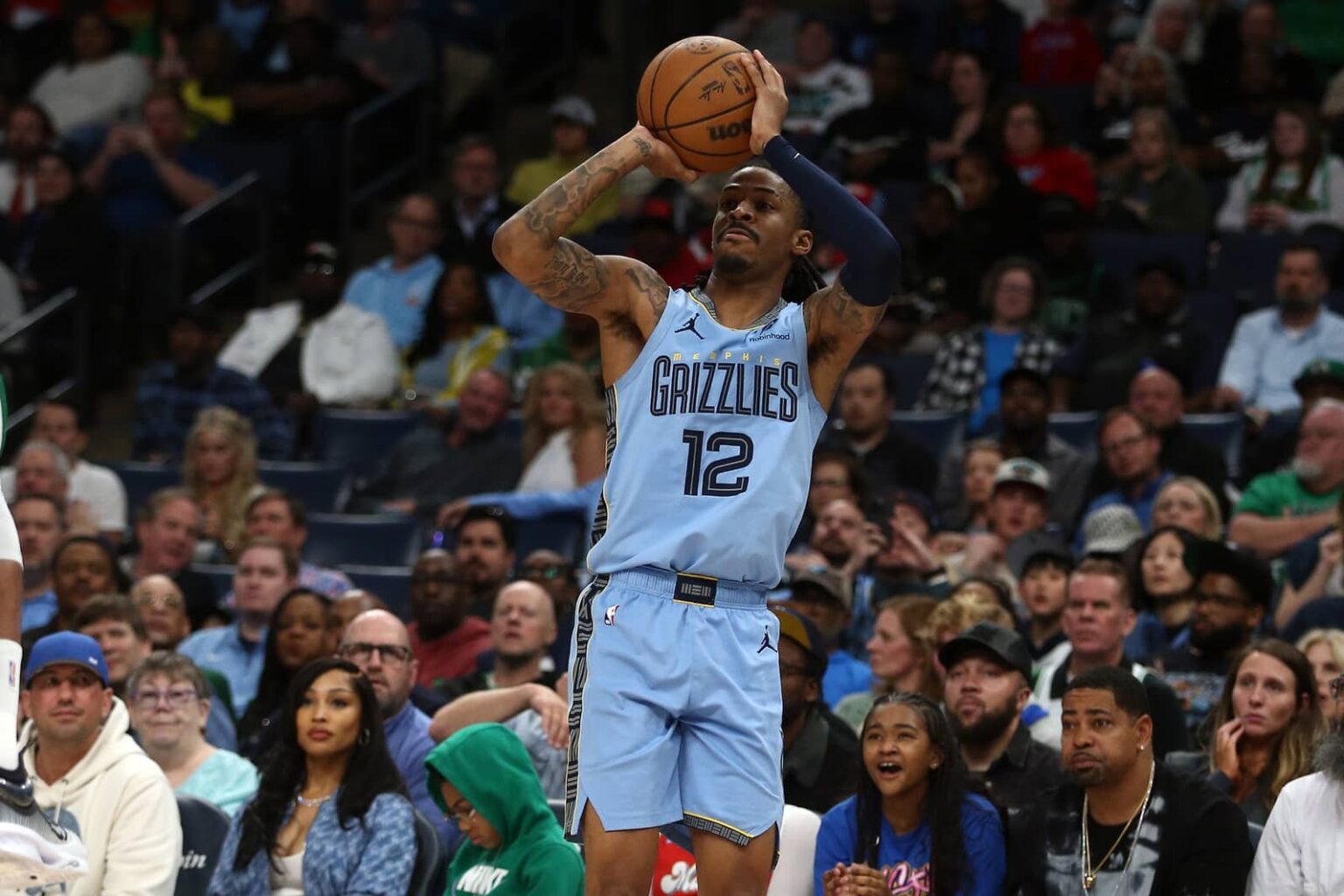 Mar 31, 2025; Memphis, Tennessee, USA; Memphis Grizzlies guard Ja Morant (12) shoots for three during the fourth quarter against the Boston Celtics at FedExForum. Mandatory Credit: Petre Thomas-Imagn Images