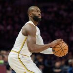 Boston Celtics guard Jaylen Brown (7) shoots against the Minnesota Timberwolves in the first quarter at Target Center.