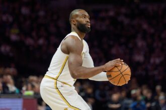 Boston Celtics guard Jaylen Brown (7) shoots against the Minnesota Timberwolves in the first quarter at Target Center.