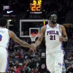 Dec 30, 2024; Portland, Oregon, USA; Philadelphia 76ers center Joel Embiid (21) and forward Paul George (8) high five during the second half against the Portland Trail Blazers at Moda Center. Mandatory Credit: Soobum Im-Imagn Images