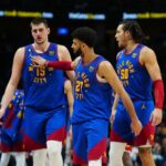 Mar 3, 2023; Denver, Colorado, USA; Denver Nuggets center Nikola Jokic (15) and guard Jamal Murray (27) and forward Aaron Gordon (50) celebrate after defeating the Memphis Grizzlies at Ball Arena. Mandatory Credit: Ron Chenoy-Imagn Images