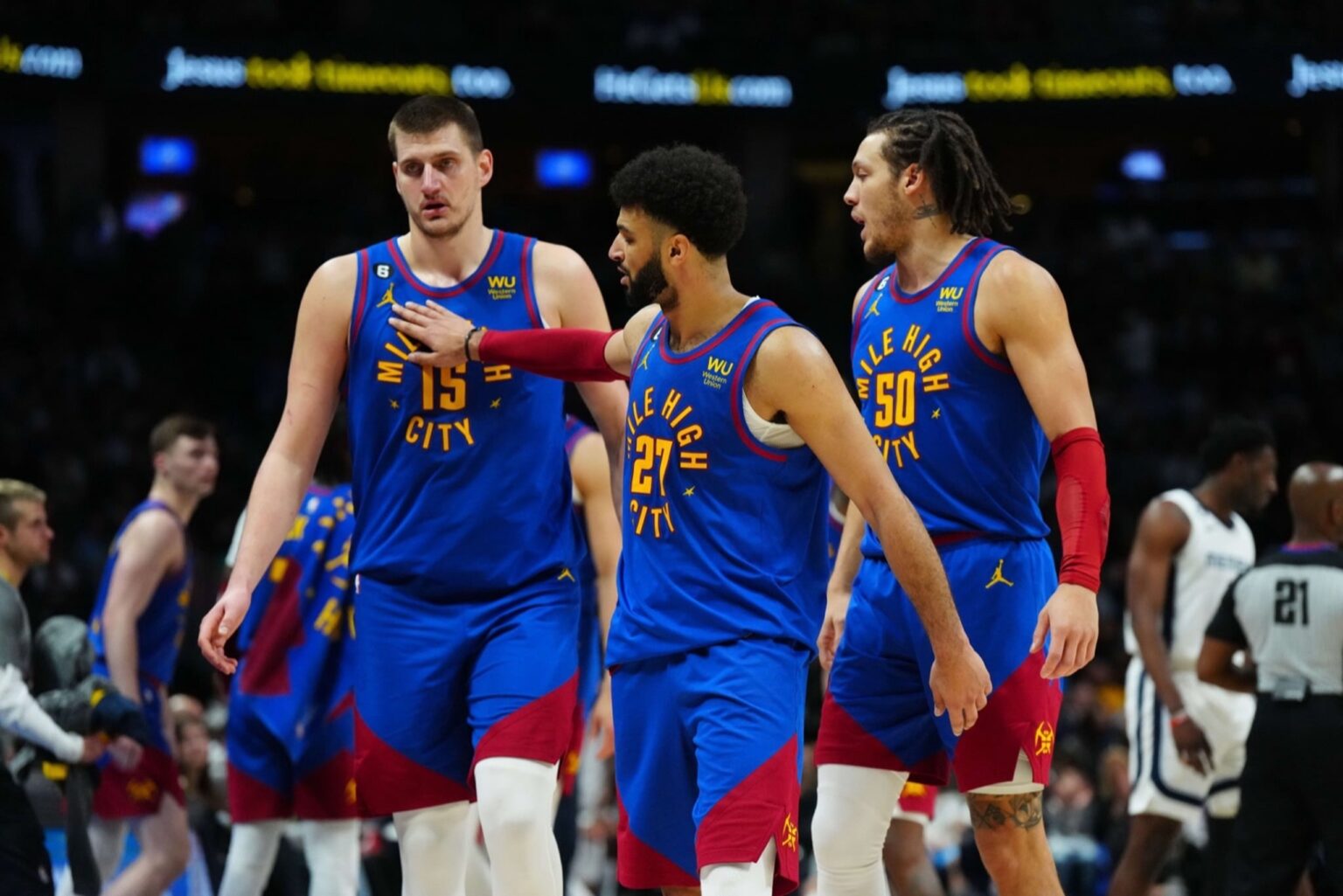 Mar 3, 2023; Denver, Colorado, USA; Denver Nuggets center Nikola Jokic (15) and guard Jamal Murray (27) and forward Aaron Gordon (50) celebrate after defeating the Memphis Grizzlies at Ball Arena. Mandatory Credit: Ron Chenoy-Imagn Images