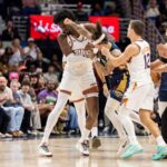 Dec 27, 2025; New Orleans, Louisiana, USA; New Orleans Pelicans guard Jose Alvarado (15) gets into a scrum with Phoenix Suns center Mark Williams (15) over a play during the second half at Smoothie King Center. Mandatory Credit: Stephen Lew-Imagn Images