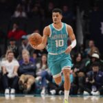 Feb 3, 2025; Charlotte, North Carolina, USA; Charlotte Hornets guard Josh Green (10) brings the ball up court against the Washington Wizards during the first half at Spectrum Center. Mandatory Credit: Jim Dedmon-Imagn Images