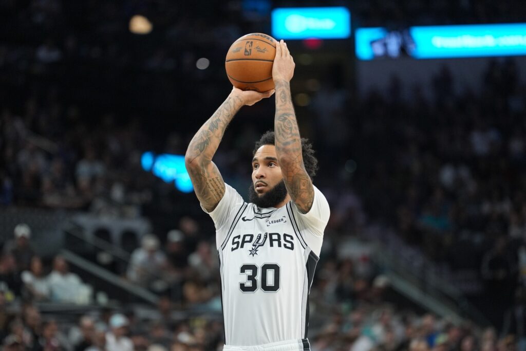 Nov 16, 2025; San Antonio, Texas, USA; San Antonio Spurs forward Julian Champagnie (30) shoots a free throw in the first half against the Sacramento Kings at Frost Bank Center. Mandatory Credit: Daniel Dunn-Imagn Images