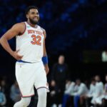 Dec 13, 2025; Las Vegas, Nevada, USA; New York Knicks center Karl-Anthony Towns (32) reacts on the court during the second quarter against against the Orlando Magic at T-Mobile Arena. Mandatory Credit: Kirby Lee-Imagn Images