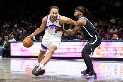 Dec 4, 2025; Brooklyn, New York, USA; Utah Jazz forward Kyle Anderson (2) moves the ball past Brooklyn Nets guard Terance Mann (14) during the fourth quarter at Barclays Center. Mandatory Credit: Tom Horak-Imagn Images