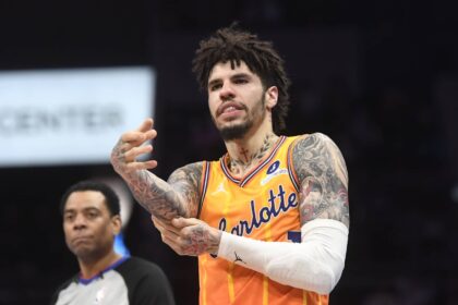 Charlotte Hornets guard LaMelo Ball (1) rubs his elbow after falling during the second half against the Atlanta Hawks at the Spectrum Center.