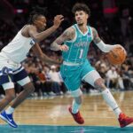 Nov 1, 2025; Charlotte, North Carolina, USA; Charlotte Hornets guard LaMelo Ball (1) handles the ball against Minnesota Timberwolves guard Bones Hyland (8) during the second quarter at Spectrum Center. Mandatory Credit: Jim Dedmon-Imagn Images