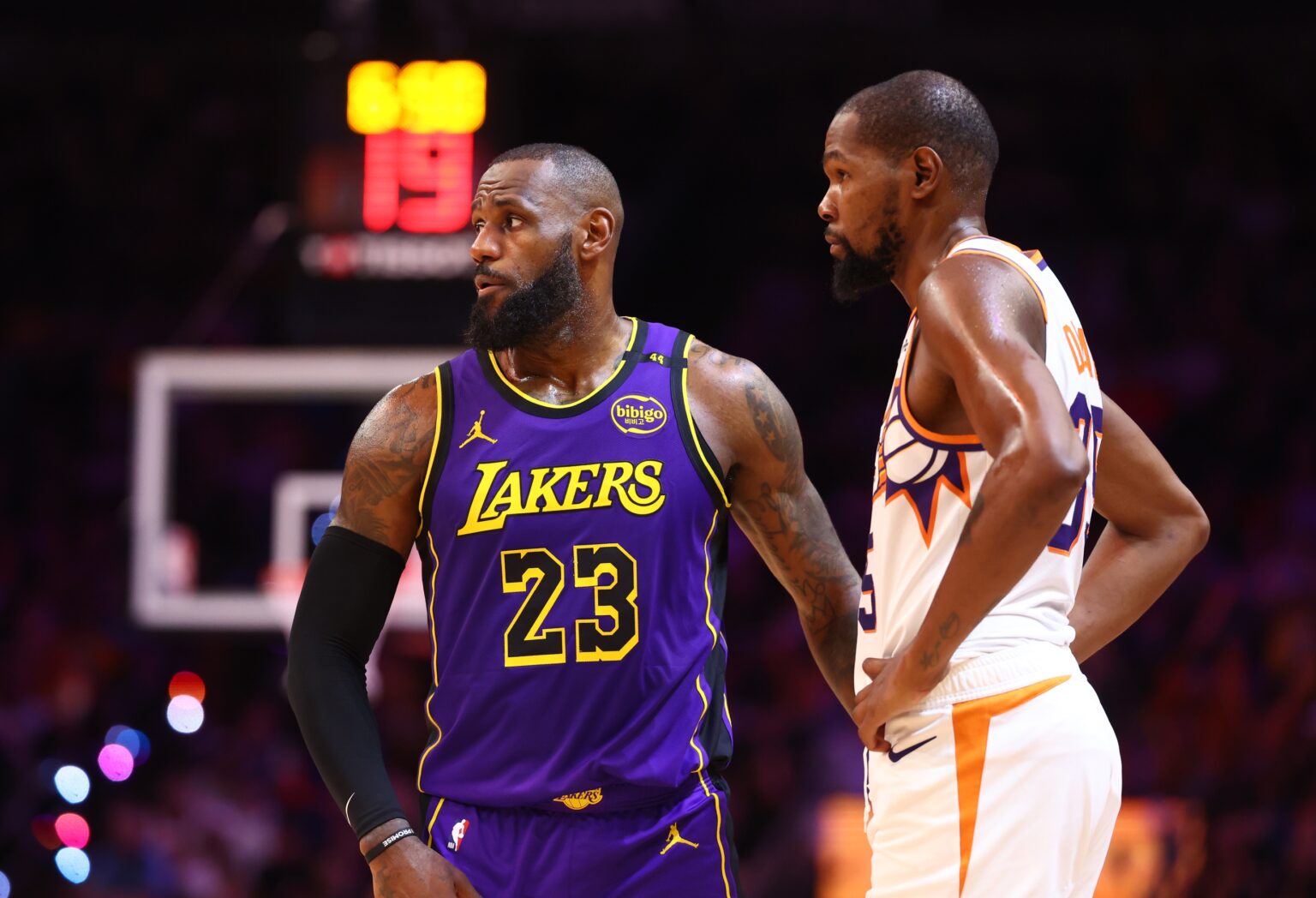 Oct 28, 2024; Phoenix, Arizona, USA; Los Angeles Lakers forward LeBron James (23) against Phoenix Suns forward Kevin Durant (35) at Footprint Center. Mandatory Credit: Mark J. Rebilas-Imagn Images