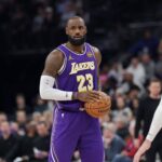 Los Angeles Lakers forward Lebron James (23) holds the ball during the second quarter against the Utah Jazz at Delta Center.