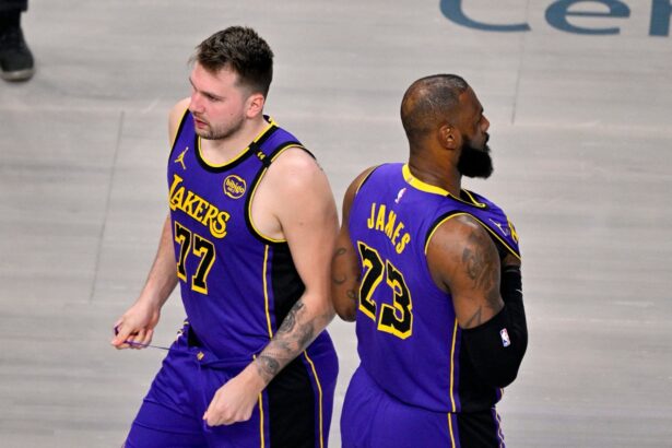 Apr 9, 2025; Dallas, Texas, USA; Los Angeles Lakers guard Luka Doncic (77) and forward LeBron James (23) during the game between the Dallas Mavericks and the Los Angeles Lakers at American Airlines Center. Mandatory Credit: Jerome Miron-Imagn Images