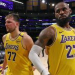 Apr 22, 2025; Los Angeles, California, USA; Los Angeles Lakers guard Luka Doncic (77) and Los Angeles Lakers forward LeBron James (23) leave a court after defeating the Minnesota Timberwolves 94-85 in game two of first round for the 2024 NBA Playoffs at Crypto.com Arena. Mandatory Credit: Kiyoshi Mio-Imagn Images