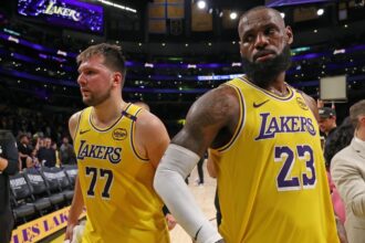 Apr 22, 2025; Los Angeles, California, USA; Los Angeles Lakers guard Luka Doncic (77) and Los Angeles Lakers forward LeBron James (23) leave a court after defeating the Minnesota Timberwolves 94-85 in game two of first round for the 2024 NBA Playoffs at Crypto.com Arena. Mandatory Credit: Kiyoshi Mio-Imagn Images