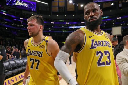 Apr 22, 2025; Los Angeles, California, USA; Los Angeles Lakers guard Luka Doncic (77) and Los Angeles Lakers forward LeBron James (23) leave a court after defeating the Minnesota Timberwolves 94-85 in game two of first round for the 2024 NBA Playoffs at Crypto.com Arena. Mandatory Credit: Kiyoshi Mio-Imagn Images