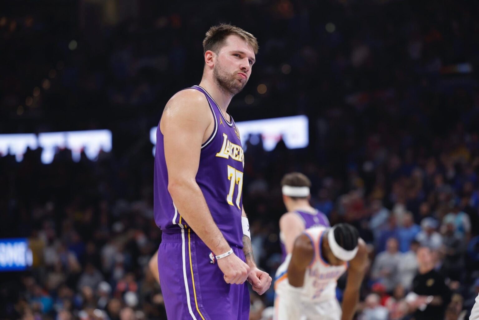 Nov 12, 2025; Oklahoma City, Oklahoma, USA; Los Angeles Lakers guard Luka Doncic reacts to a fan during the second quarter of a game against the Oklahoma City Thunder at Paycom Center. Mandatory Credit: Alonzo Adams-Imagn Images