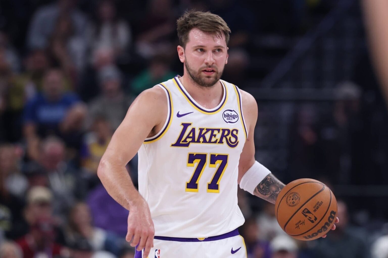 Nov 23, 2025; Salt Lake City, Utah, USA; Los Angeles Lakers guard Luka Doncic (77) brings the ball up the court against the Utah Jazz during the first half at Delta Center. Mandatory Credit: Rob Gray-Imagn Images