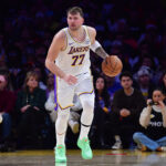 Dec 25, 2025; Los Angeles, California, USA; Los Angeles Lakers guard Luka Doncic (77) moves the ball against the Houston Rockets during the first half at Crypto.com Arena. Mandatory Credit: Gary A. Vasquez-Imagn Images