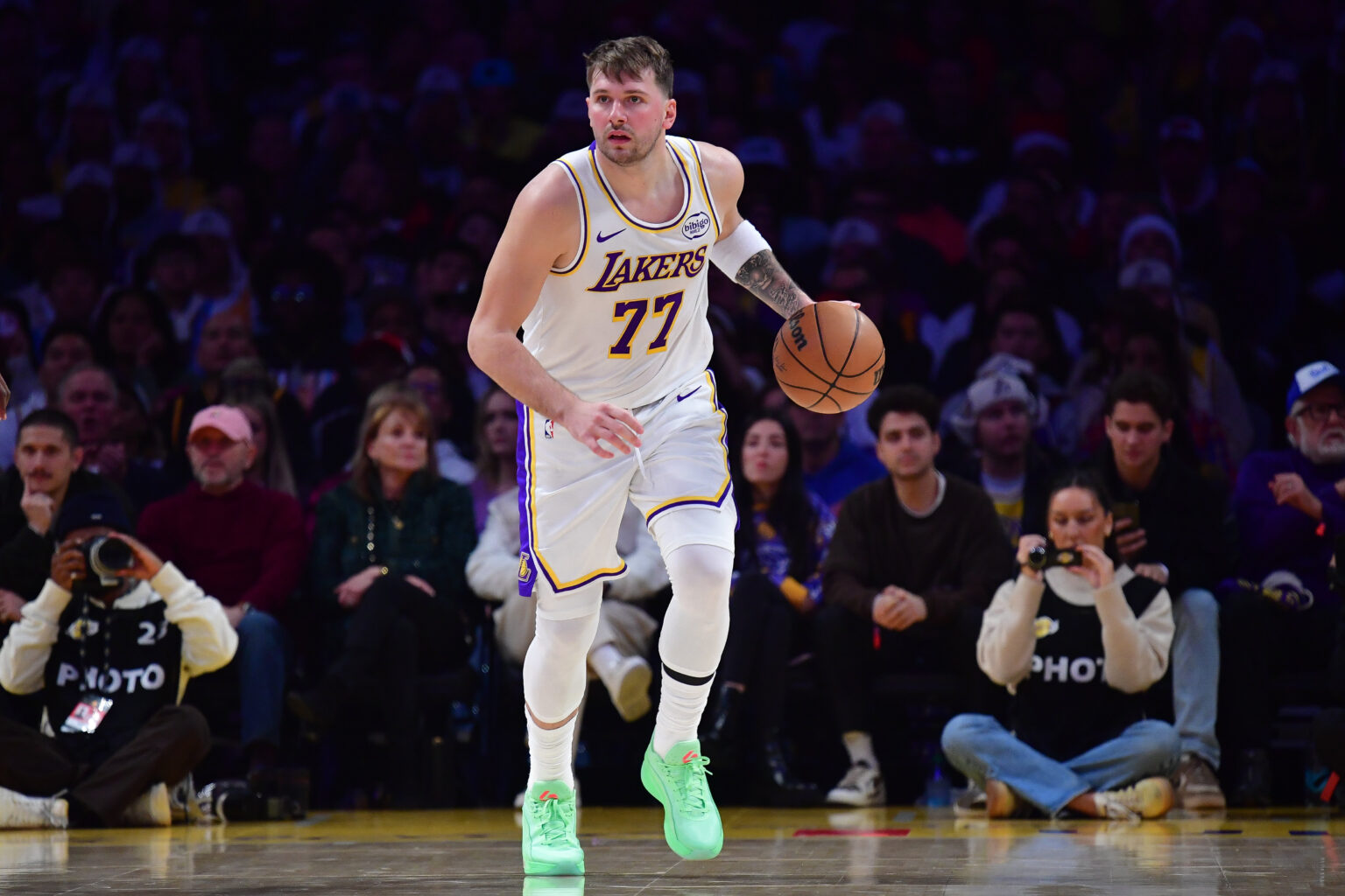 Dec 25, 2025; Los Angeles, California, USA; Los Angeles Lakers guard Luka Doncic (77) moves the ball against the Houston Rockets during the first half at Crypto.com Arena. Mandatory Credit: Gary A. Vasquez-Imagn Images