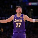 Nov 28, 2025; Los Angeles, California, USA; Los Angeles Lakers guard Luka Doncic (77) reacts after a foul on Dallas Mavericks forward Naji Marshall (13) in the second half at Crypto.com Arena. Mandatory Credit: Jayne Kamin-Oncea-Imagn Images