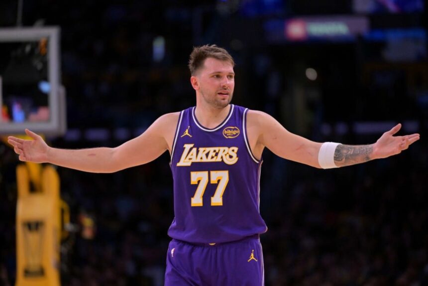 Los Angeles, California, USA; Los Angeles Lakers guard Luka Doncic (77) reacts after a foul on Dallas Mavericks forward Naji Marshall (13) in the second half at Crypto.com Arena. Mandatory Credit: Jayne Kamin-Oncea-Imagn Images